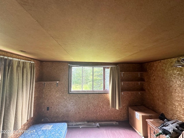 unfurnished bedroom with wood-type flooring