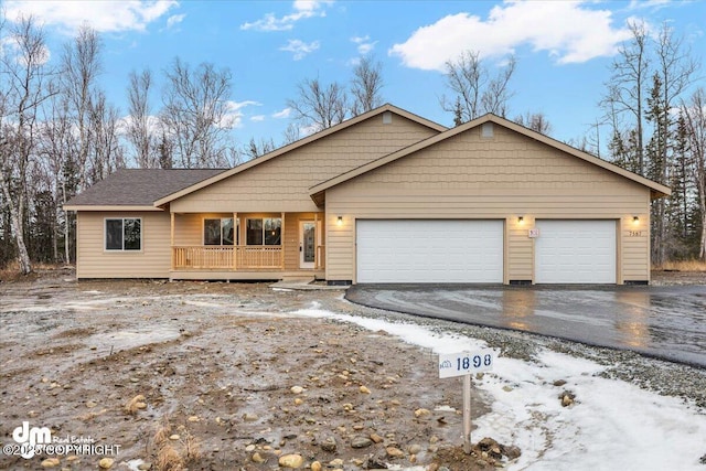 view of front of home with a garage and covered porch