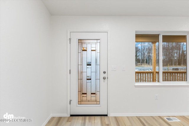 doorway with light hardwood / wood-style floors