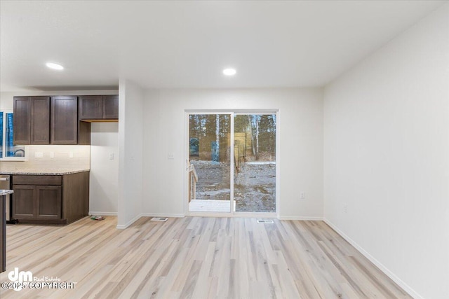 interior space with light hardwood / wood-style floors