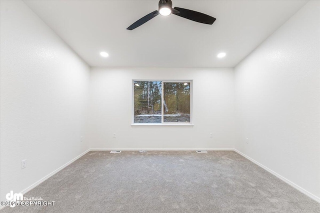 unfurnished room featuring ceiling fan and carpet flooring