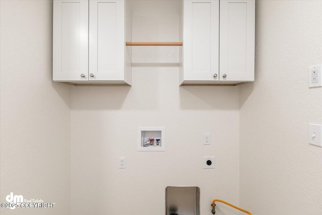 laundry room with cabinets, hookup for a washing machine, and electric dryer hookup