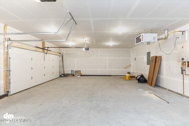 garage featuring a garage door opener and electric panel