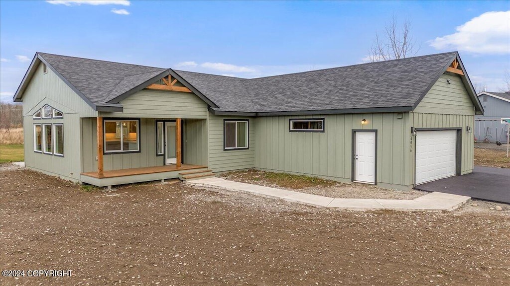 view of front of house with a garage and a porch