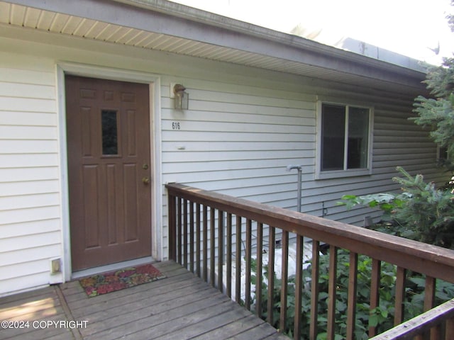 doorway to property featuring a wooden deck