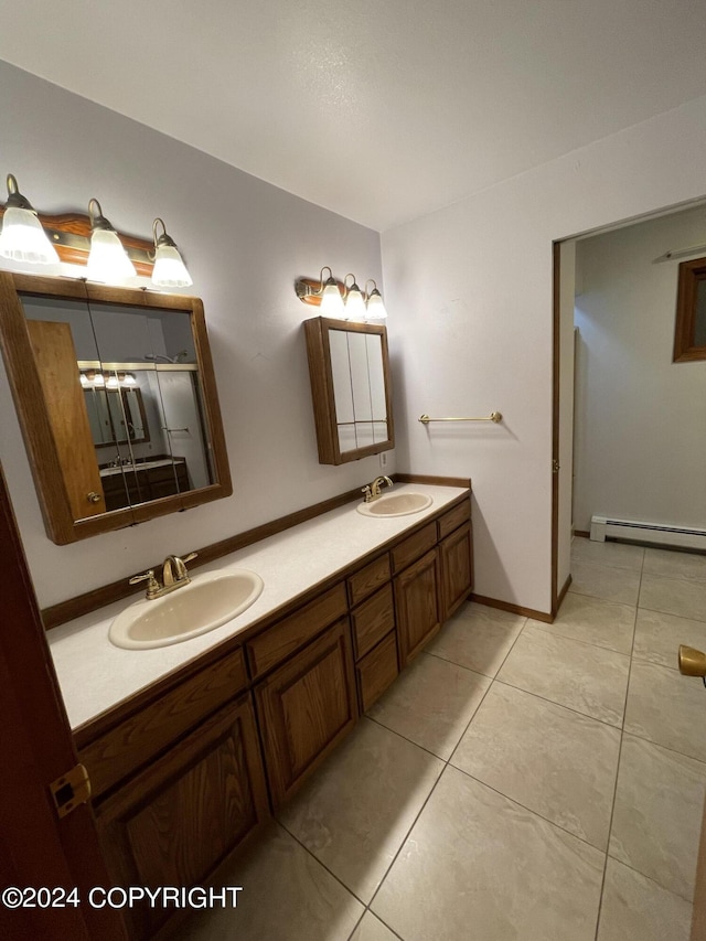 bathroom with vanity, tile patterned flooring, and a baseboard heating unit