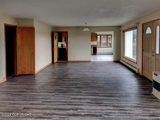 unfurnished living room featuring a baseboard radiator and dark wood-type flooring