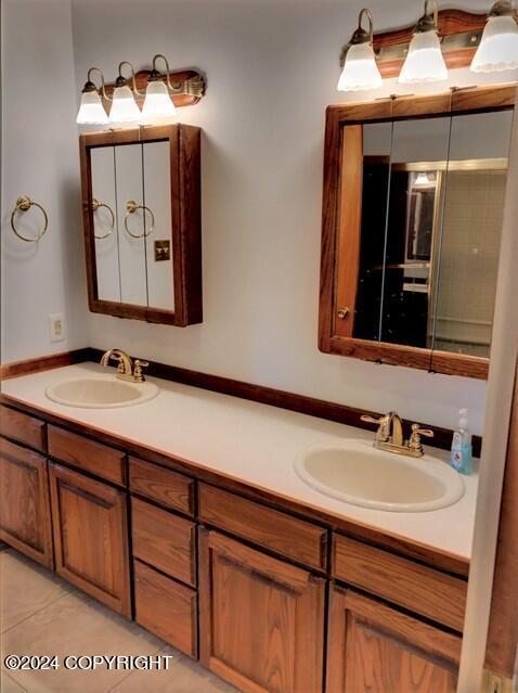 bathroom with tile patterned flooring and vanity