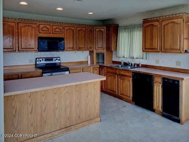 kitchen featuring sink and black appliances