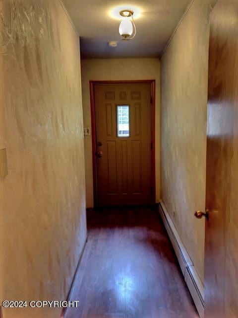 doorway with baseboard heating