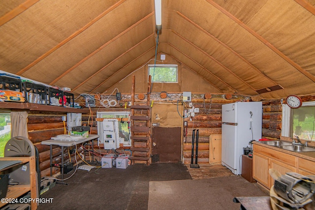 miscellaneous room with lofted ceiling, a sink, and log walls