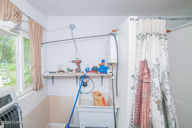 interior space with laundry area and heating unit