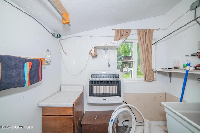 laundry area featuring heating unit