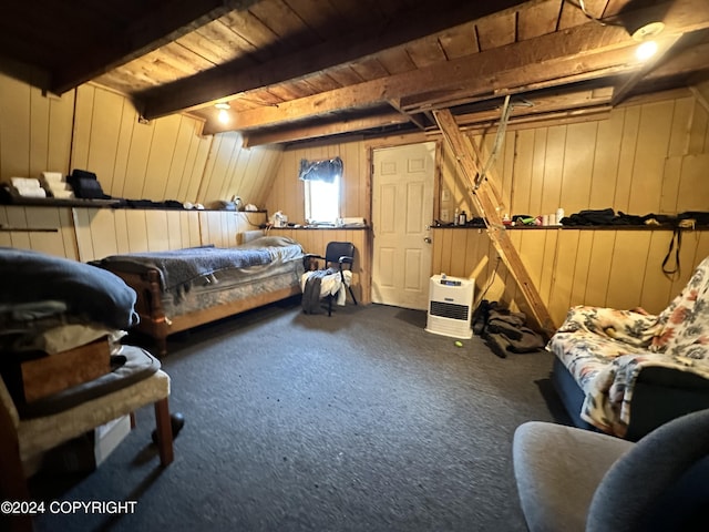 carpeted bedroom with wooden walls, wooden ceiling, and beam ceiling