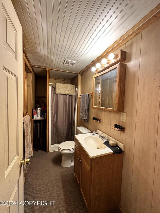 full bathroom featuring visible vents, toilet, vanity, a shower with curtain, and wood ceiling