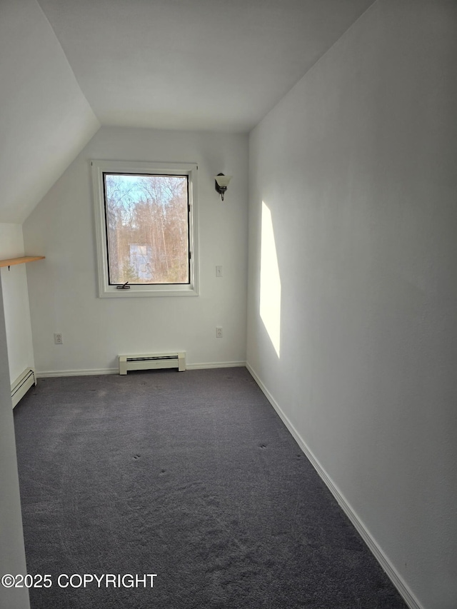 bonus room featuring a baseboard radiator, vaulted ceiling, dark carpet, and baseboards