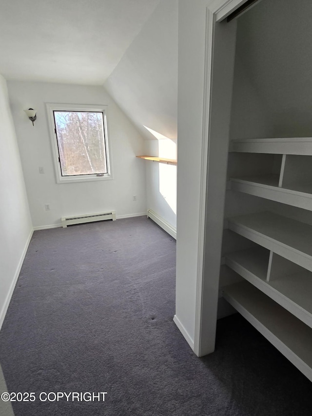 bonus room with lofted ceiling, a baseboard radiator, a baseboard heating unit, carpet flooring, and baseboards