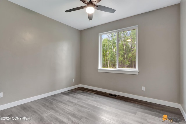 unfurnished room with ceiling fan and light hardwood / wood-style floors