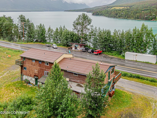 drone / aerial view featuring a water and mountain view