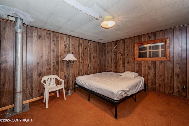 bedroom featuring carpet floors and a textured ceiling