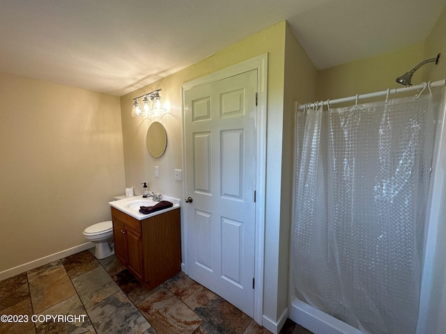 bathroom with vanity, tile patterned flooring, and toilet