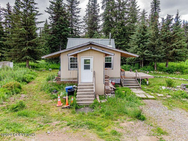 manufactured / mobile home with an outbuilding and a wooden deck