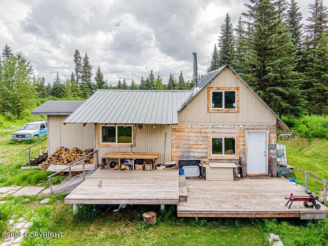 back of property featuring a wooden deck