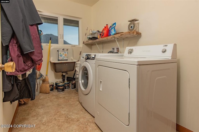 laundry area with washing machine and clothes dryer