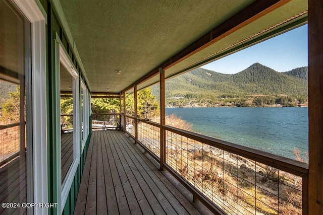 exterior space featuring a water and mountain view