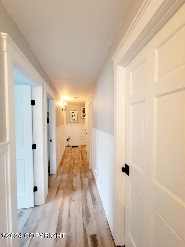 corridor featuring light wood-type flooring