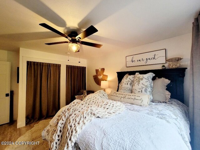 bedroom featuring ceiling fan and light wood-type flooring