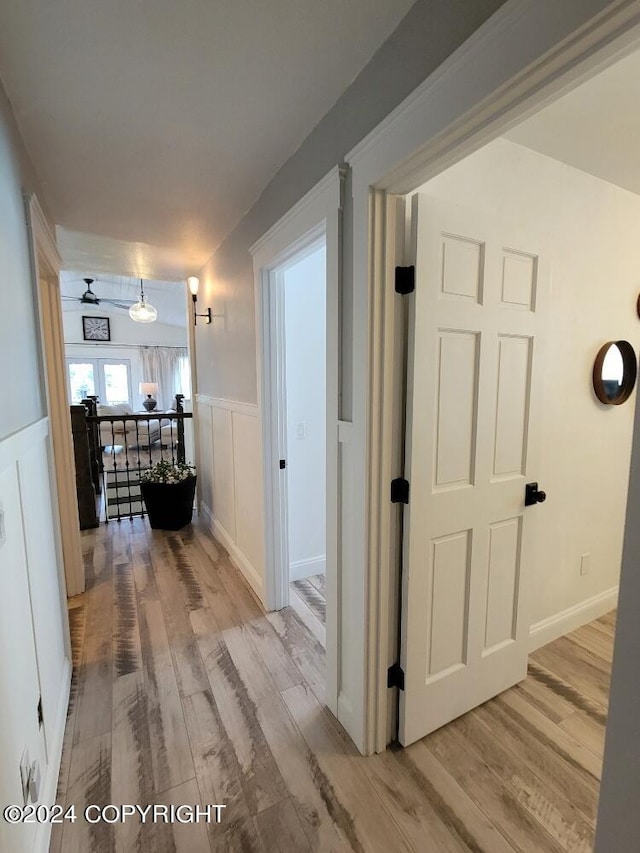 corridor featuring wood-type flooring