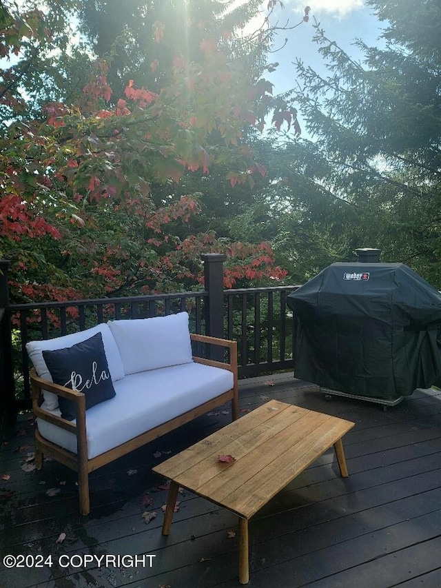 wooden terrace featuring a grill