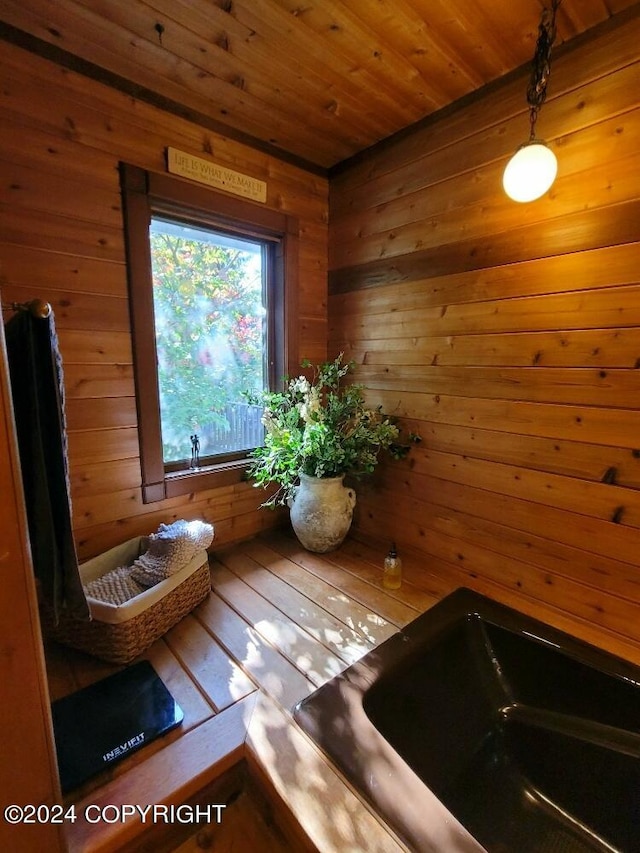 view of sauna / steam room featuring wood ceiling, wooden walls, and hardwood / wood-style flooring