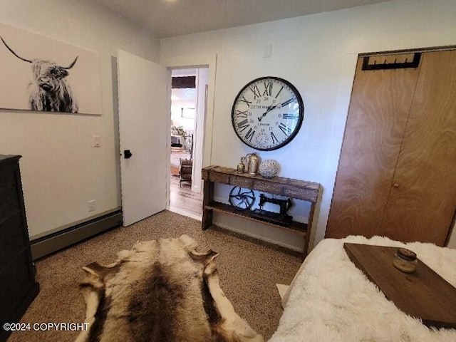 bedroom featuring a baseboard heating unit