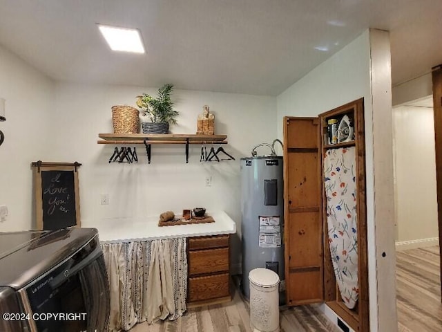 interior space with light hardwood / wood-style flooring and electric water heater