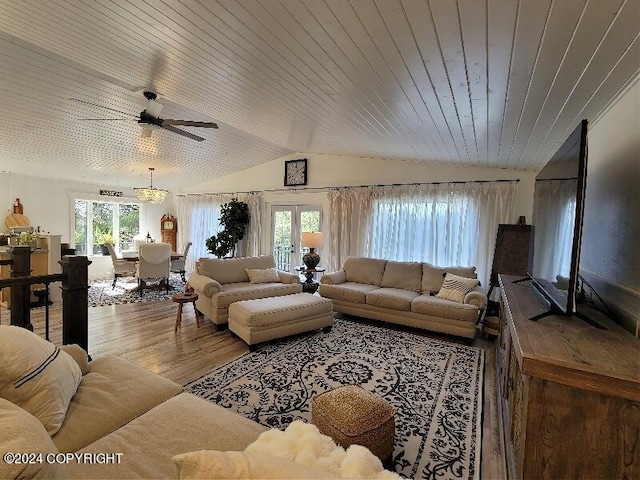 living room featuring ceiling fan, french doors, plenty of natural light, and hardwood / wood-style floors