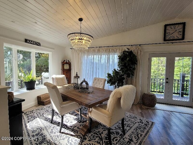 dining area with french doors, wood-type flooring, lofted ceiling, and a healthy amount of sunlight