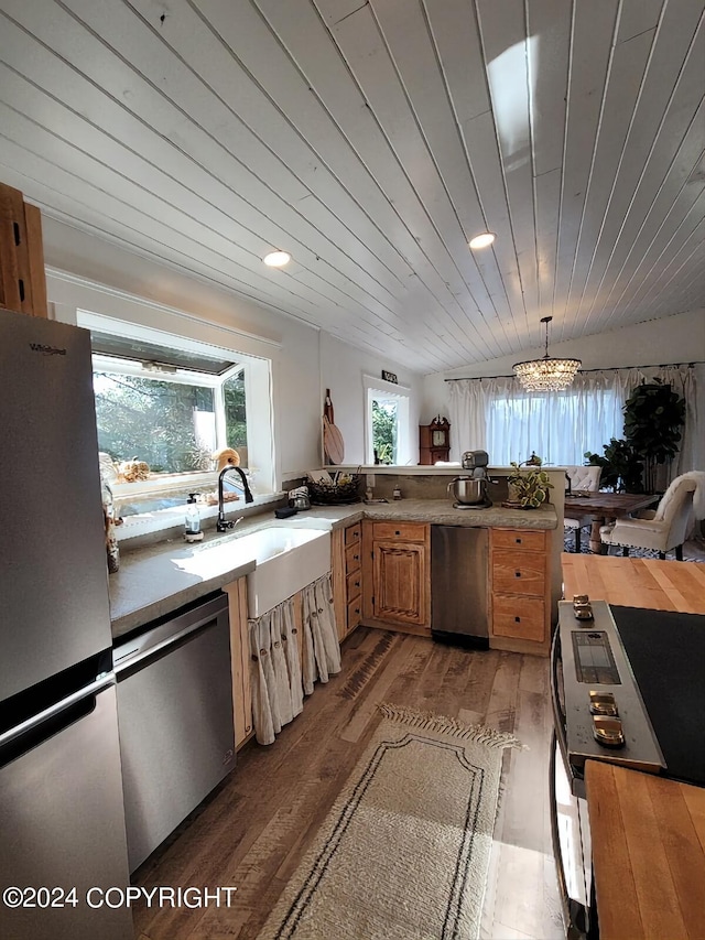 kitchen with appliances with stainless steel finishes, light wood-type flooring, a chandelier, and wooden ceiling