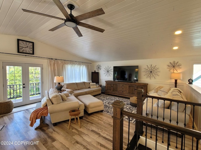 living room with wooden ceiling, lofted ceiling, ceiling fan, french doors, and hardwood / wood-style flooring