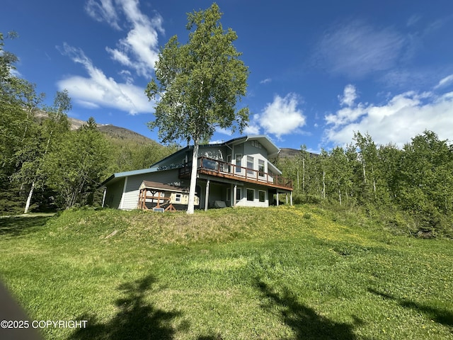 4477 Panther Dr, Eagle River, AK 99577 - back of property featuring a wooden deck