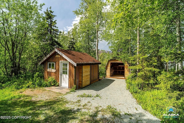 4477 Panther Dr, Eagle River, AK 99577 - view of outbuilding with gravel driveway