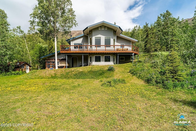 4477 Panther Dr, Eagle River, AK 99577 - back of property with a wooden deck and a lawn