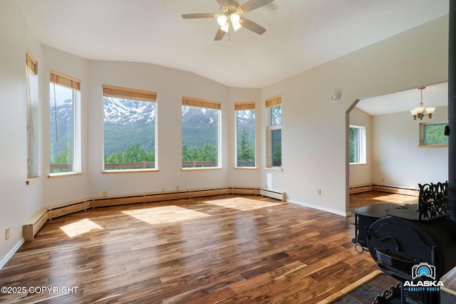 4477 Panther Dr, Eagle River, AK 99577 - unfurnished living room with wood finished floors, a chandelier, lofted ceiling, a ceiling fan, and baseboards
