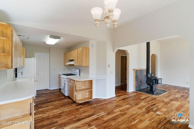 4477 Panther Dr, Eagle River, AK 99577 - kitchen featuring white appliances, open shelves, under cabinet range hood, arched walkways, and light countertops