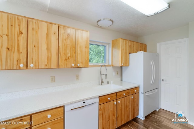 4477 Panther Dr, Eagle River, AK 99577 - kitchen featuring white appliances, a sink, dark wood finished floors, and light countertops
