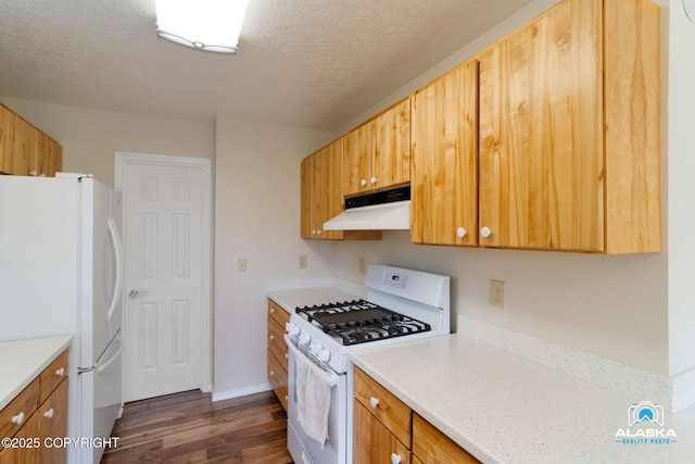 4477 Panther Dr, Eagle River, AK 99577 - kitchen featuring white appliances, under cabinet range hood, dark wood finished floors, light countertops, and a textured ceiling