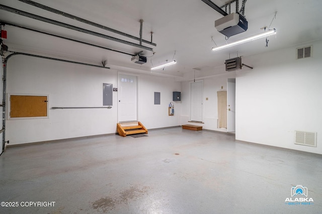 4477 Panther Dr, Eagle River, AK 99577 - garage with a garage door opener, electric panel, and a heating unit