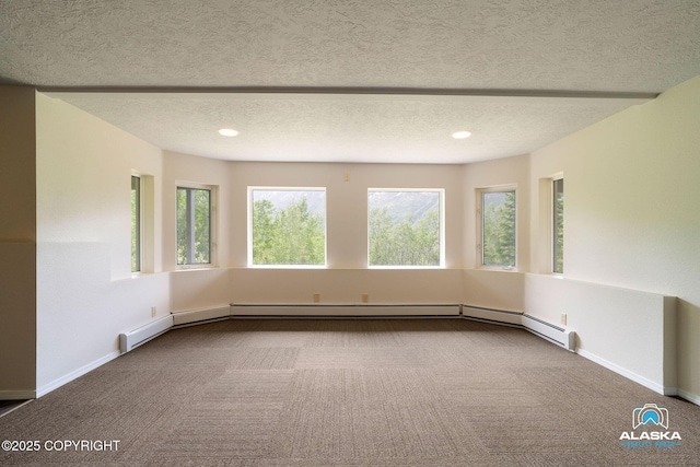 4477 Panther Dr, Eagle River, AK 99577 - carpeted spare room with a textured ceiling, recessed lighting, baseboards, and a baseboard radiator