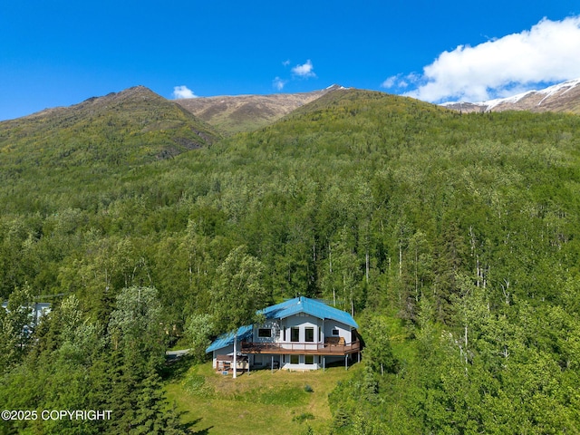 4477 Panther Dr, Eagle River, AK 99577 - view of mountain backdrop featuring a heavily wooded area